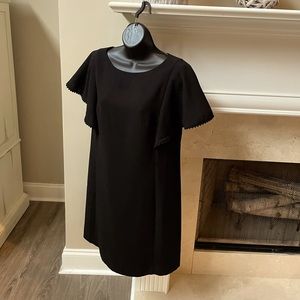 A beautiful  classy short sleeve dress, the sleeves have a beautiful trim on it.